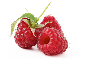 raspberry with green leaf on a white background