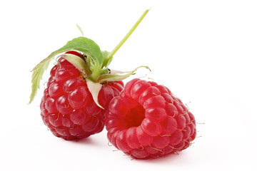 raspberry with green leaf on a white background