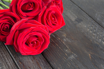 red rose on wood background