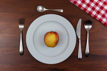 apple on a white plate