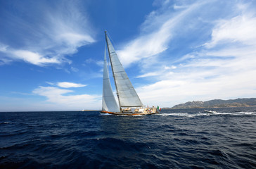 Fototapeta na wymiar Beautiful yacht sailling at full spead in Sardinia, Italy