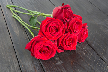 red rose on wood background