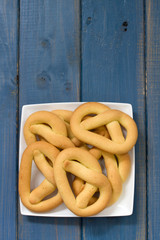 cookies in plate on blue wooden background