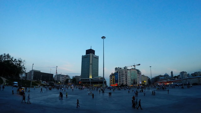 Time-lapse video of people walking in taksim square taken at sunset