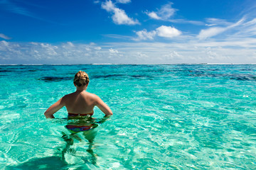 Fototapeta na wymiar Girl in a paradise tropical sea