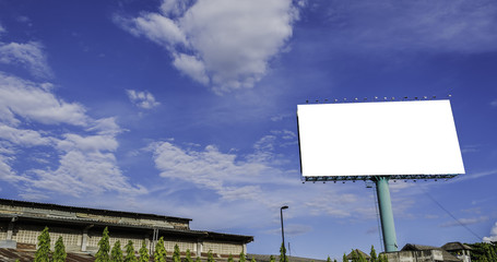 advertisement bill board with blue sky in background.