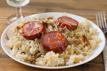 duck rice with chourico on plate