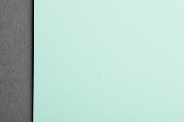 Mint color paper sheet over the grey background