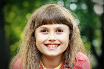 Happy child girl on a green background