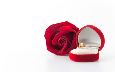 red rose and ring box isolated on white background