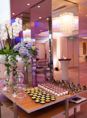 Table with snacks and cocktails