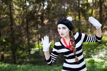 Emotional Mime on the park background