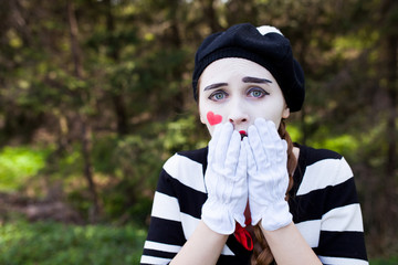 Emotional Mime on the park background