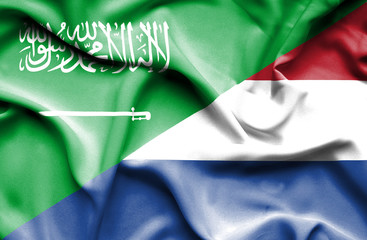 Waving flag of Netherlands and Saudi Arabia