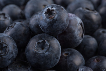 Blueberries on stone plate background