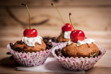 tasty muffin cakes with chocolate, spices and coffee seeds, close up