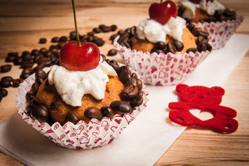 tasty muffin cakes with chocolate, spices and coffee seeds, close up