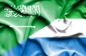 Waving flag of Sierra Leone and Saudi Arabia