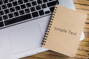 Office desk bamboo table with computer and note book, simple
