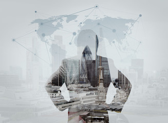 double exposure of businessman stands successfully on building t