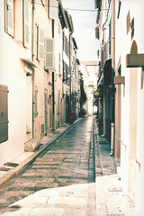 Pretty narrow street with shops in Saint-Tropez in France