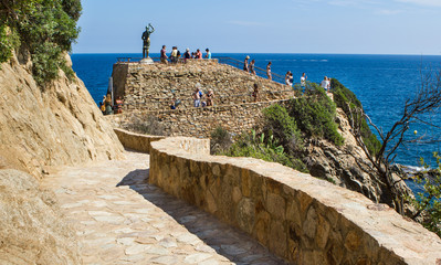 Nice coastline view in Lloret de Mar in Spain with an old brick road