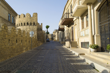 Ancient fortress wall with watchtower in Baku old town, Azerbaijan