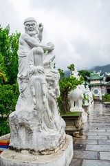 Fototapeta na wymiar The statue of buddha ( goddess of mercy - Quan Am ) in Linh Ung Pagoda, Da Nang, Vietnam