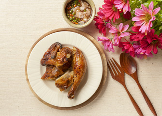 Thai style grill chicken set on canvas background