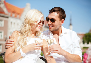 couple drinking wine in cafe