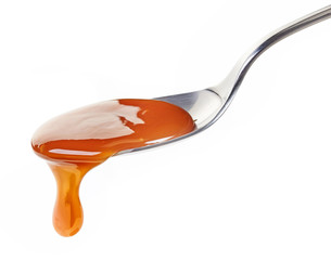 spoon of caramel sauce