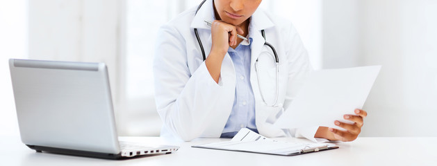 female doctor with laptop pc