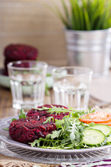 Beetroot vegan burgers with rice and beans