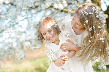 Fototapeta premium Portrait of two little girls girlfriends spring