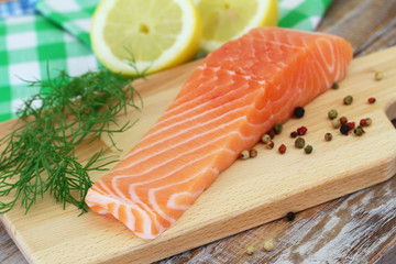 Salmon steak on wooden board
