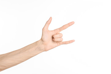 Hand gestures theme: the human hand shows gestures isolated on white background in studio