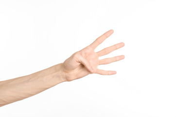 Hand gestures theme: the human hand shows gestures isolated on white background in studio