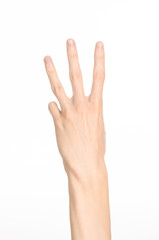 Fototapeta premium Hand gestures theme: the human hand shows gestures isolated on white background in studio