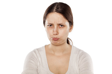 sulk young woman on a white background