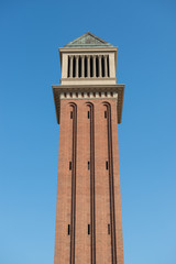 Fototapeta na wymiar One of the two Venetian towers located at Placa de Espanya in Barcelona, Spain