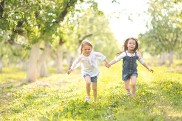 Fototapeta premium Portrait of two girls in the woods girlfriends