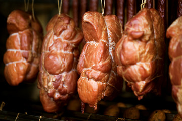 Smoked ham on a chopping board.
