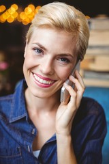 Smiling pretty blonde on the phone