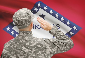 Soldier saluting to US state flag series - Arkansas