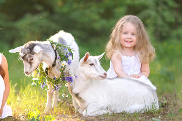 Fototapeta premium portrait of a beautiful little girl in summer