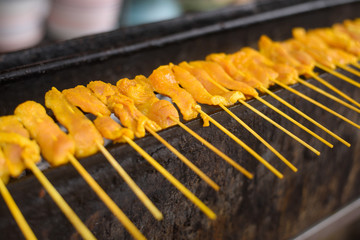 Grilled spices pork (named Satay in Thai)