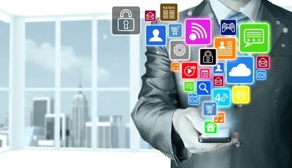 Business man using smart phone with social media icon set