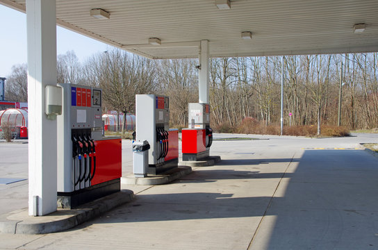 Car petrol gas station.Empty gas station with red roof and pumps.