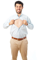 young man acting like a super hero and tearing his shirt off on a white background