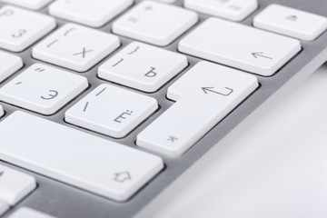 White buttons on silver keyboard